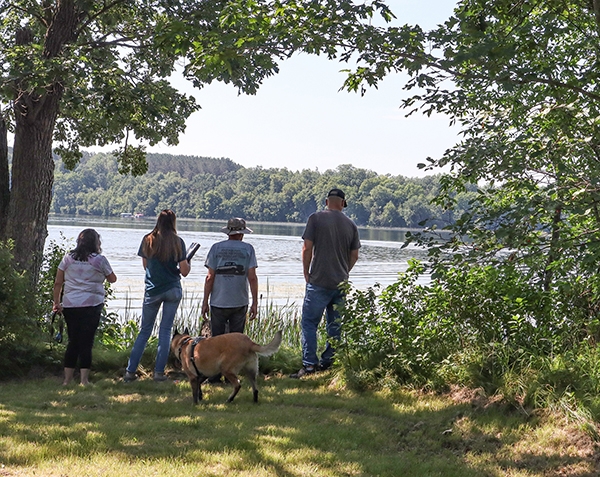 Shoreline site visit with landowners and two soil and water conservation district staff.